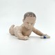 antique figurine "Baby with a sock"