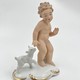 Antique figurine "Putti with a goatling"