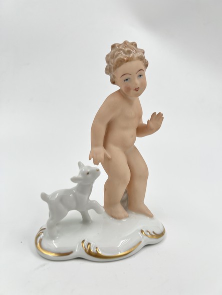 Antique figurine "Putti with a goatling"