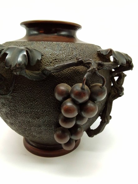 Antique vase with grapes