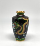 A small vase with a dragon