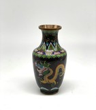 A small vase with a dragon