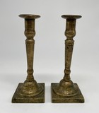 Antique paired candlesticks