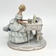 Антикварная скульптура «Девушка за пианино»