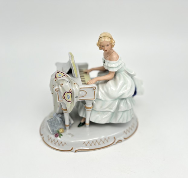 Antique sculpture "Girl at the piano"