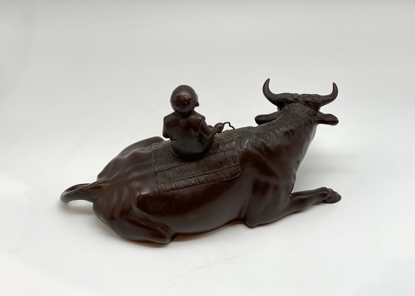 Antique sculpture "Boy on a buffalo"
