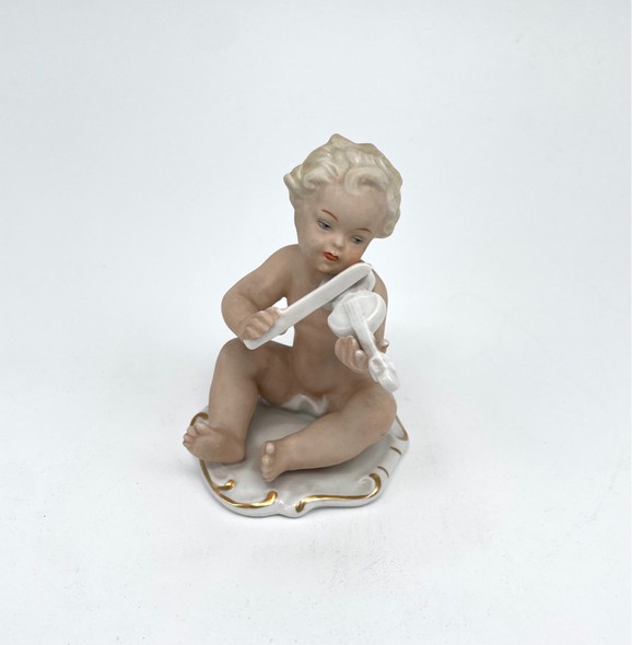Antique figurine “Putti with violin”