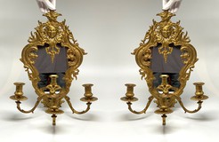 Antique paired sconces with mirrors