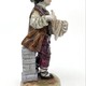 Antique statuette "Boy with a figurine"