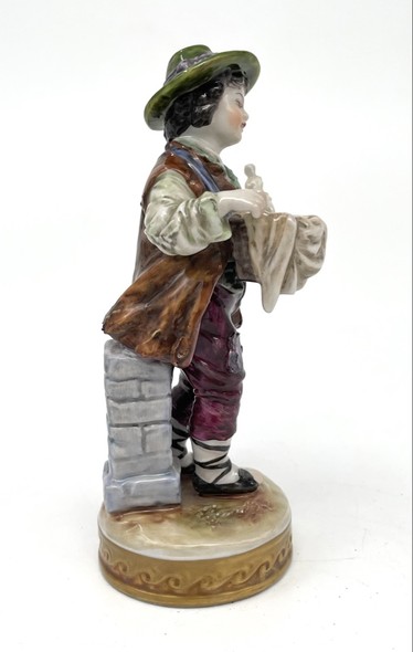 Antique statuette "Boy with a figurine"