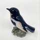 Antique bird figurine