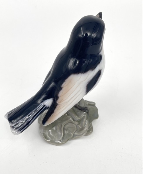 Antique bird figurine