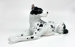 Antique figurine of a lying dog