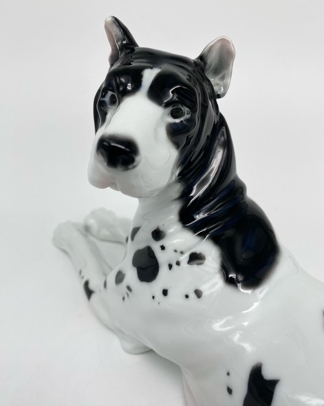 Antique figurine of a lying dog