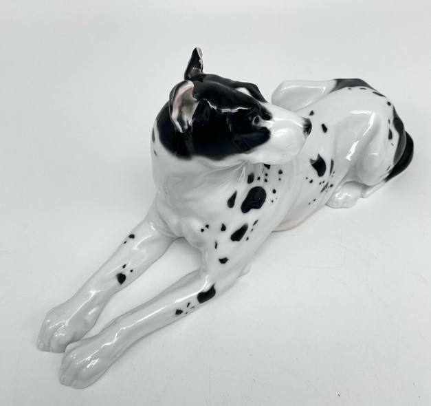 Antique figurine of a lying dog