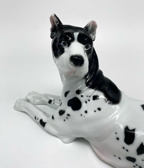 Antique figurine of a lying dog