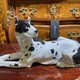 Antique figurine of a lying dog