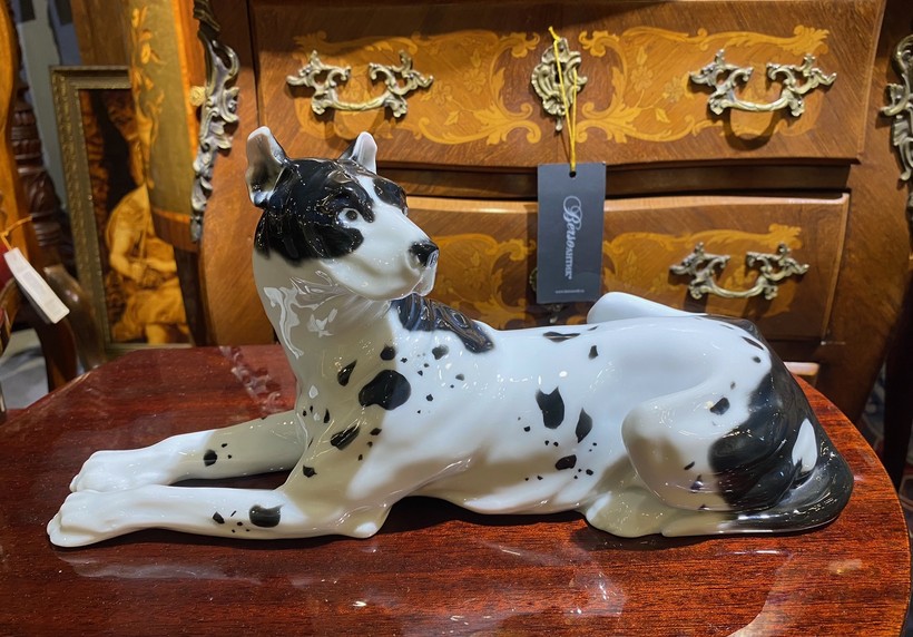 Antique figurine of a lying dog