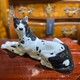 Antique figurine of a lying dog