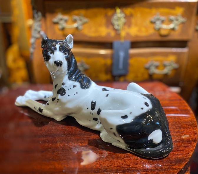 Antique figurine of a lying dog