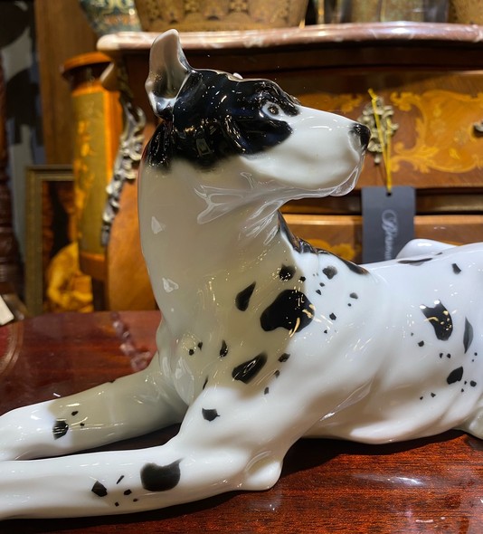 Antique figurine of a lying dog