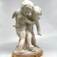 Antique sculpture "Cupids beating for the heart"