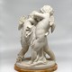 Antique sculpture "Cupids beating for the heart"