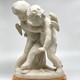 Antique sculpture "Cupids beating for the heart"