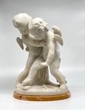 Antique sculpture "Cupids beating for the heart"