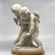 Antique sculpture "Cupids beating for the heart"