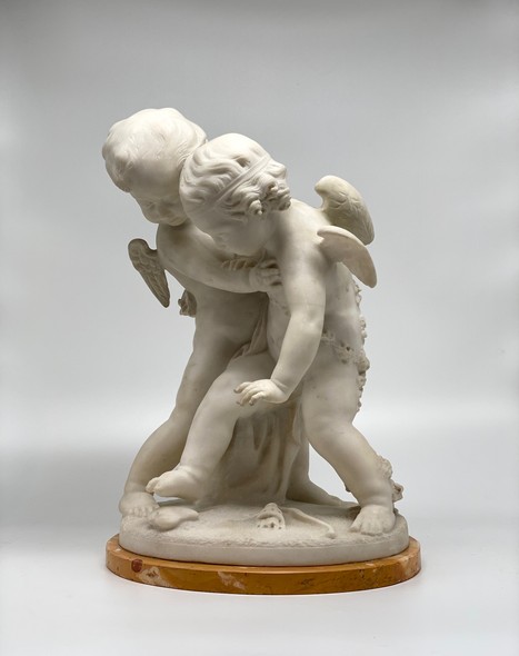 Antique sculpture "Cupids beating for the heart"