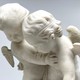 Antique sculpture "Cupids beating for the heart"