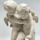 Antique sculpture "Cupids beating for the heart"