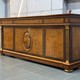 An antique chest of drawers in the neoclassical style