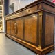 An antique chest of drawers in the neoclassical style