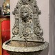 Wall-mounted ancient fountain