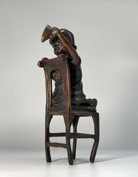Vintage statuette "Girl on a chair"
