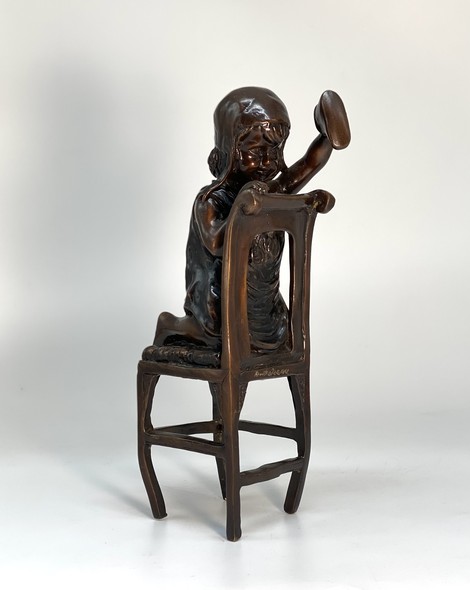 Vintage statuette "Girl on a chair"