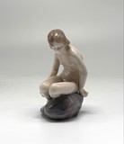 Antique figurine "Girl on the stone"