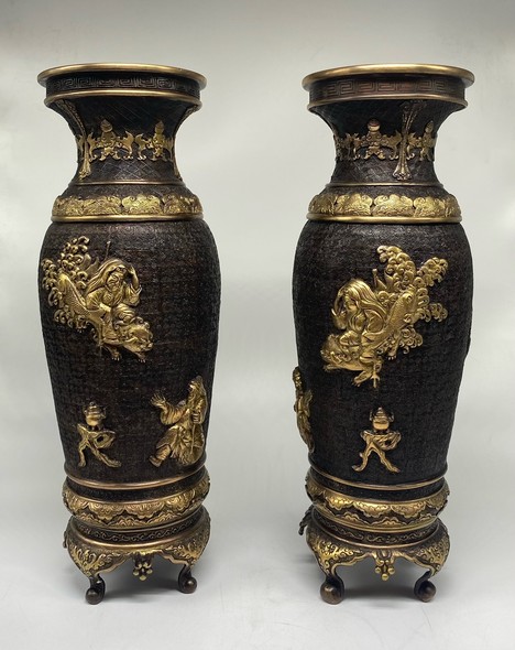 Paired oriental vases
with dragons and Bodhisattvas