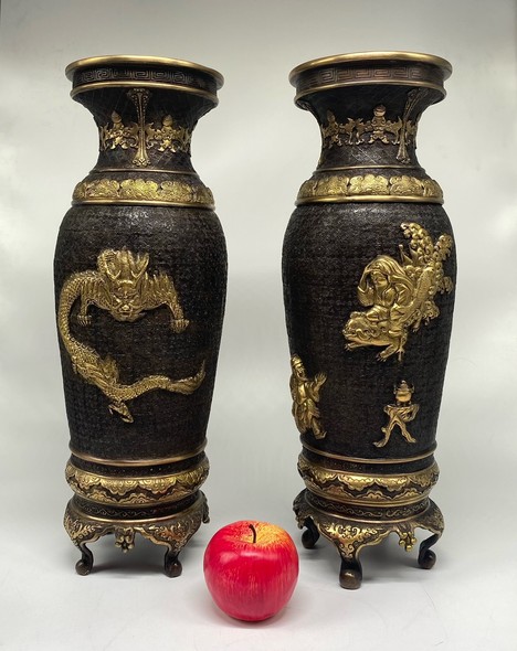 Paired oriental vases
with dragons and Bodhisattvas