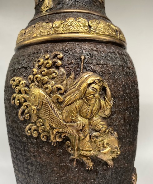 Paired oriental vases
with dragons and Bodhisattvas
