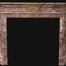 old pink marble fireplace