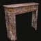 old pink marble fireplace