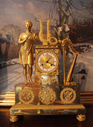 Old mantel clock "Orpheus", Bronze and gilding with enameled clock face. France, the early XIXth C.