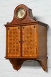 Antique wall cabinet and clock
