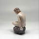 Antique figurine "Girl on the stone"