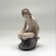 Antique figurine "Girl on the stone"