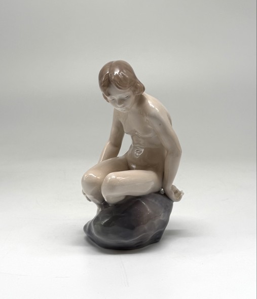 Antique figurine "Girl on the stone"