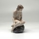 Antique figurine "Girl on the stone"